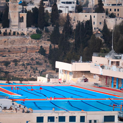 3. צילום בריכת השחייה החיצונית של ענבל ירושלים, עם העיר העתיקה ברקע.